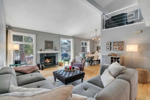12 Oakvale Place Sw, Calgary, AB - Indoor Photo Showing Living Room With Fireplace