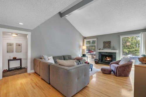 12 Oakvale Place Sw, Calgary, AB - Indoor Photo Showing Living Room With Fireplace