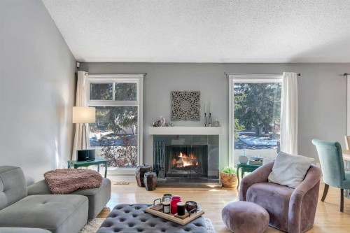 12 Oakvale Place Sw, Calgary, AB - Indoor Photo Showing Living Room With Fireplace