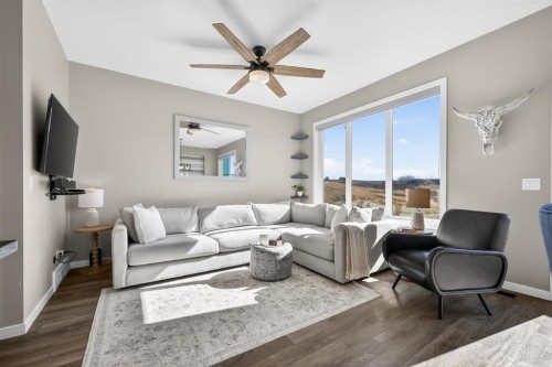 205 Sunset Point, Cochrane, AB - Indoor Photo Showing Living Room