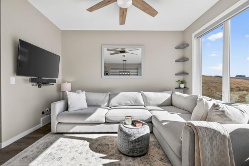 205 Sunset Point, Cochrane, AB - Indoor Photo Showing Living Room