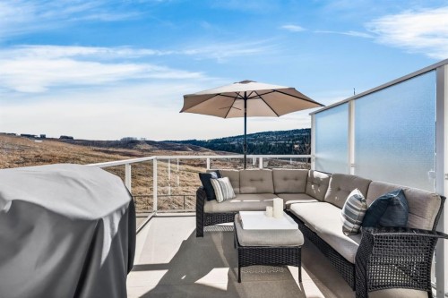 205 Sunset Point, Cochrane, AB - Outdoor With Deck Patio Veranda