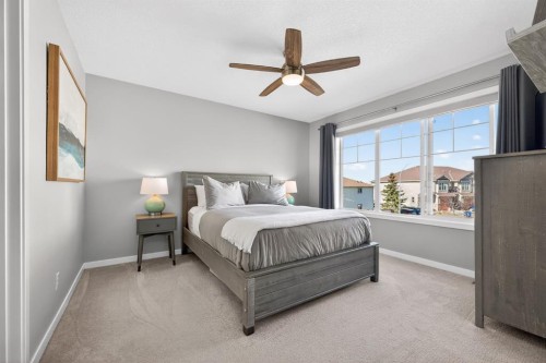 205 Sunset Point, Cochrane, AB - Indoor Photo Showing Bedroom