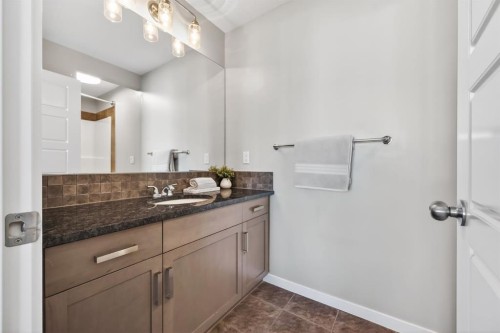 205 Sunset Point, Cochrane, AB - Indoor Photo Showing Bathroom