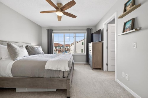 205 Sunset Point, Cochrane, AB - Indoor Photo Showing Bedroom
