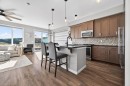 205 Sunset Point, Cochrane, AB  - Indoor Photo Showing Kitchen With Upgraded Kitchen 