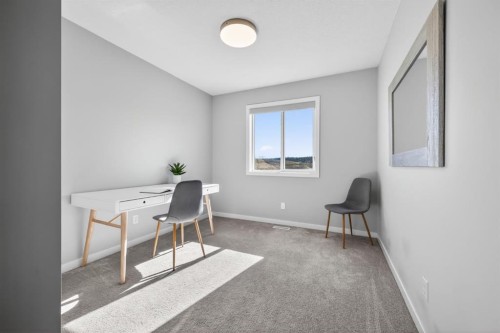 205 Sunset Point, Cochrane, AB - Indoor Photo Showing Other Room