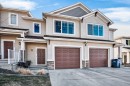 205 Sunset Point, Cochrane, AB  - Outdoor With Facade 