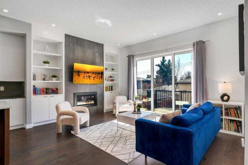 947 31 Avenue Nw, Calgary, AB - Indoor Photo Showing Living Room With Fireplace
