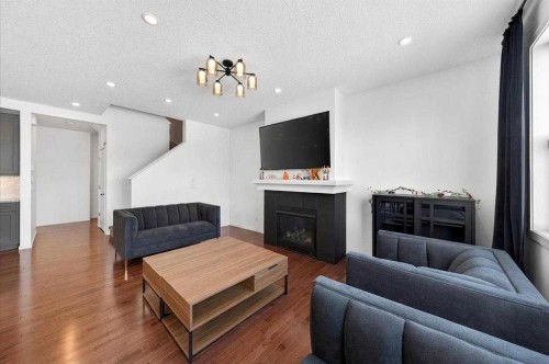 20 Nolancrest Green Nw, Calgary, AB - Indoor Photo Showing Living Room With Fireplace
