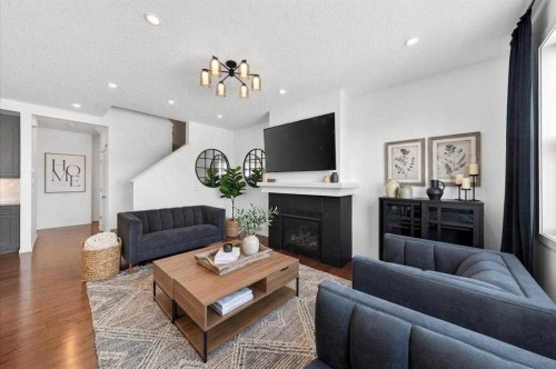 20 Nolancrest Green Nw, Calgary, AB - Indoor Photo Showing Living Room With Fireplace