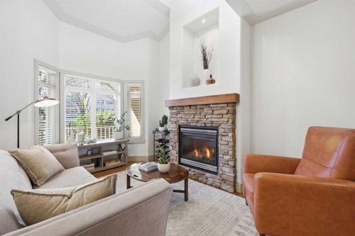 4014 Patricia Landing Sw, Calgary, AB - Indoor Photo Showing Living Room With Fireplace