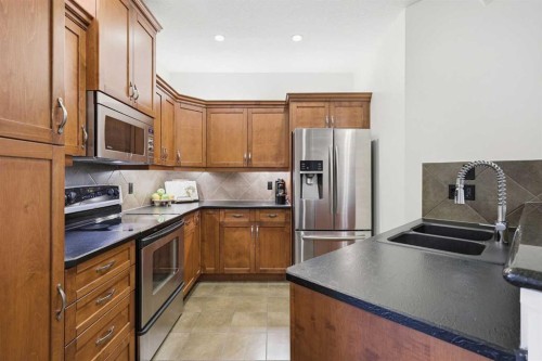 4014 Patricia Landing Sw, Calgary, AB - Indoor Photo Showing Kitchen With Stainless Steel Kitchen With Double Sink