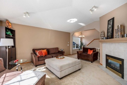 15 Valley Brook Circle Nw, Calgary, AB - Indoor Photo Showing Living Room With Fireplace