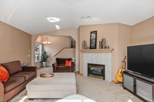 15 Valley Brook Circle Nw, Calgary, AB - Indoor Photo Showing Living Room With Fireplace