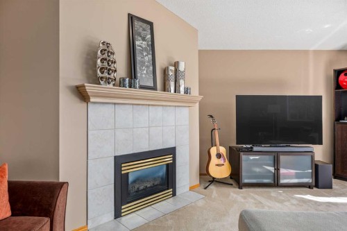 15 Valley Brook Circle Nw, Calgary, AB - Indoor Photo Showing Living Room With Fireplace