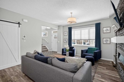31 Lucas Boulevard Nw, Calgary, AB - Indoor Photo Showing Living Room With Fireplace