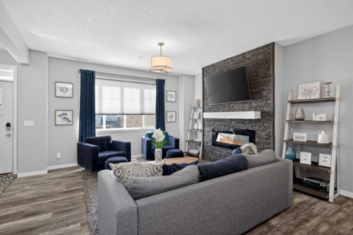 31 Lucas Boulevard Nw, Calgary, AB - Indoor Photo Showing Living Room With Fireplace