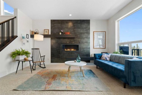 61 Cougar Ridge Cove Sw, Calgary, AB - Indoor Photo Showing Living Room With Fireplace