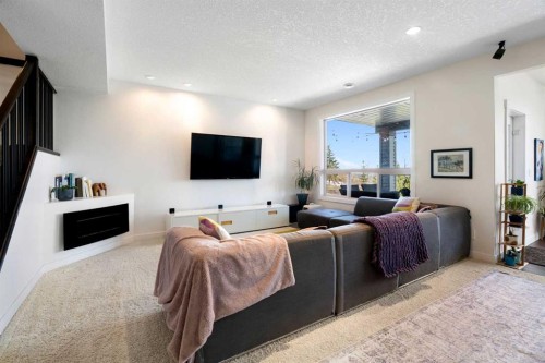 61 Cougar Ridge Cove Sw, Calgary, AB - Indoor Photo Showing Living Room