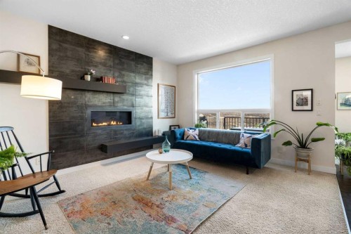 61 Cougar Ridge Cove Sw, Calgary, AB - Indoor Photo Showing Living Room With Fireplace