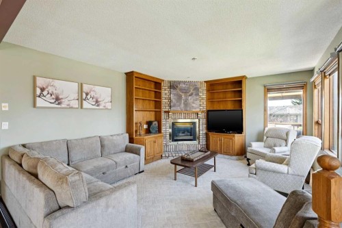 111 Scenic Ridge Court Nw, Calgary, AB - Indoor Photo Showing Living Room With Fireplace