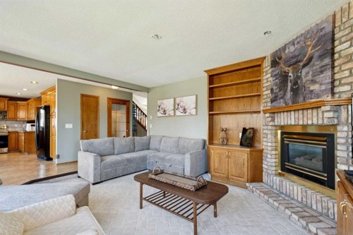111 Scenic Ridge Court Nw, Calgary, AB - Indoor Photo Showing Living Room With Fireplace