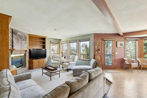 111 Scenic Ridge Court Nw, Calgary, AB - Indoor Photo Showing Living Room With Fireplace