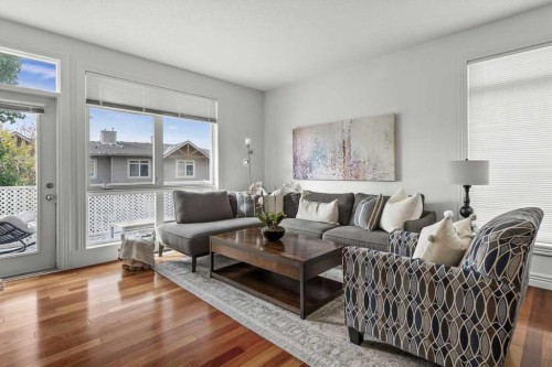 1-164 Rockyledge View Nw, Calgary, AB - Indoor Photo Showing Living Room