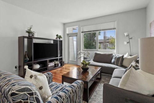 1-164 Rockyledge View Nw, Calgary, AB - Indoor Photo Showing Living Room