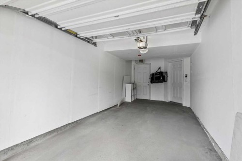 1-164 Rockyledge View Nw, Calgary, AB - Indoor Photo Showing Garage
