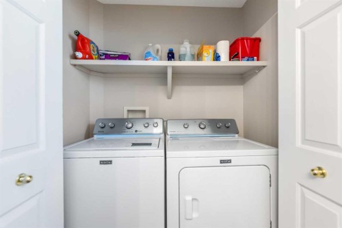114 Rocky Ridge Green Nw, Calgary, AB - Indoor Photo Showing Laundry Room