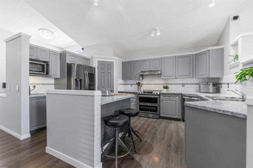 114 Rocky Ridge Green Nw, Calgary, AB - Indoor Photo Showing Kitchen With Upgraded Kitchen