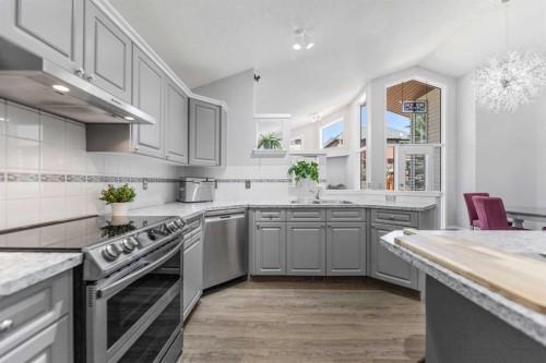 114 Rocky Ridge Green Nw, Calgary, AB - Indoor Photo Showing Kitchen With Upgraded Kitchen