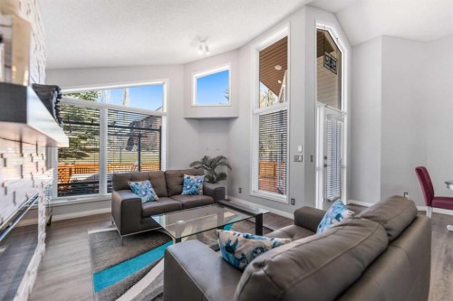 114 Rocky Ridge Green Nw, Calgary, AB - Indoor Photo Showing Living Room