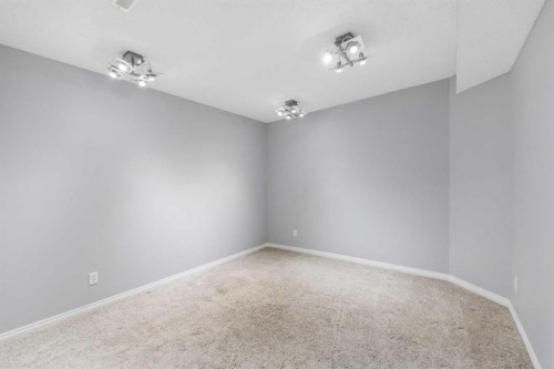 114 Rocky Ridge Green Nw, Calgary, AB - Indoor Photo Showing Other Room