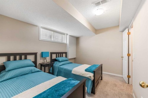 114 Rocky Ridge Green Nw, Calgary, AB - Indoor Photo Showing Bedroom