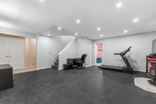 114 Rocky Ridge Green Nw, Calgary, AB - Indoor Photo Showing Gym Room