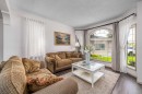 648 Scimitar Bay Nw, Calgary, AB  - Indoor Photo Showing Living Room 