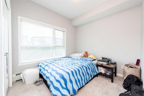 116-4350 Seton Drive Se, Calgary, AB - Indoor Photo Showing Bedroom
