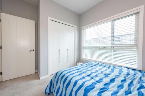116-4350 Seton Drive Se, Calgary, AB - Indoor Photo Showing Bedroom