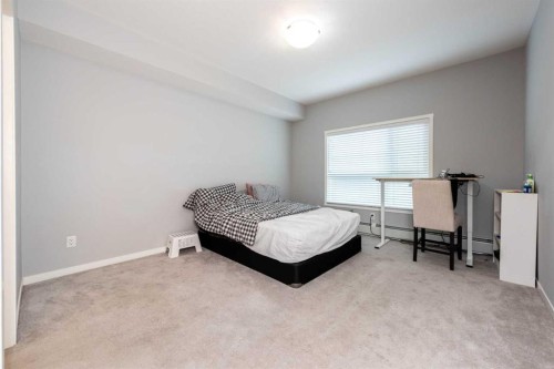 116-4350 Seton Drive Se, Calgary, AB - Indoor Photo Showing Bedroom