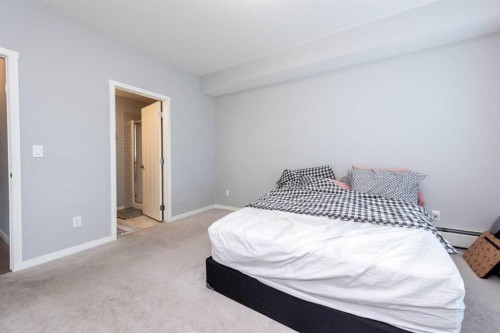 116-4350 Seton Drive Se, Calgary, AB - Indoor Photo Showing Bedroom
