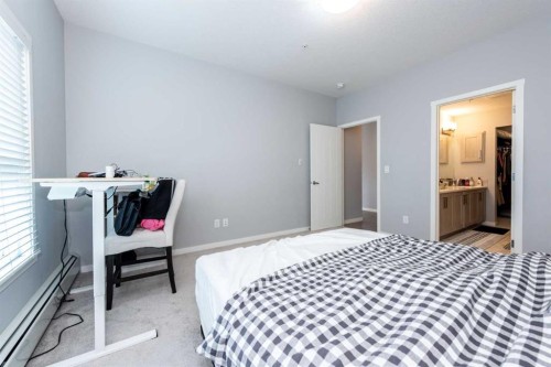 116-4350 Seton Drive Se, Calgary, AB - Indoor Photo Showing Bedroom