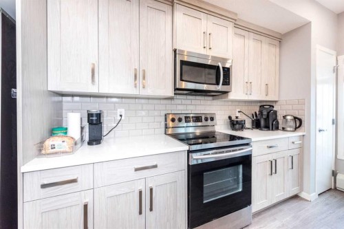 116-4350 Seton Drive Se, Calgary, AB - Indoor Photo Showing Kitchen With Upgraded Kitchen