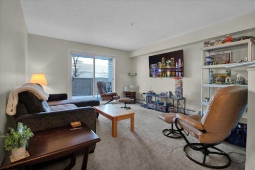 4122-4975 130 Avenue Se, Calgary, AB - Indoor Photo Showing Living Room
