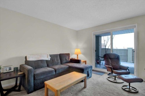 4122-4975 130 Avenue Se, Calgary, AB - Indoor Photo Showing Living Room