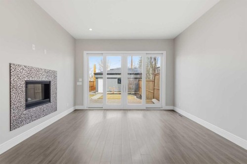 2052 46 Avenue Sw, Calgary, AB - Indoor Photo Showing Living Room With Fireplace
