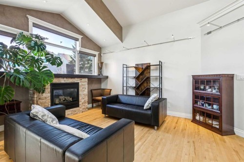 367 Discovery Place Sw, Calgary, AB - Indoor Photo Showing Living Room With Fireplace