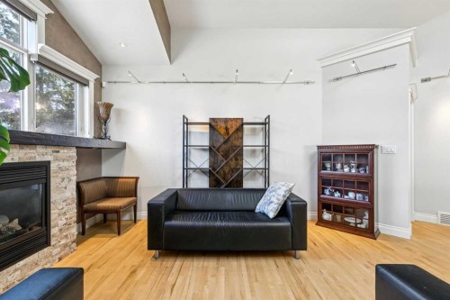 367 Discovery Place Sw, Calgary, AB - Indoor Photo Showing Living Room With Fireplace